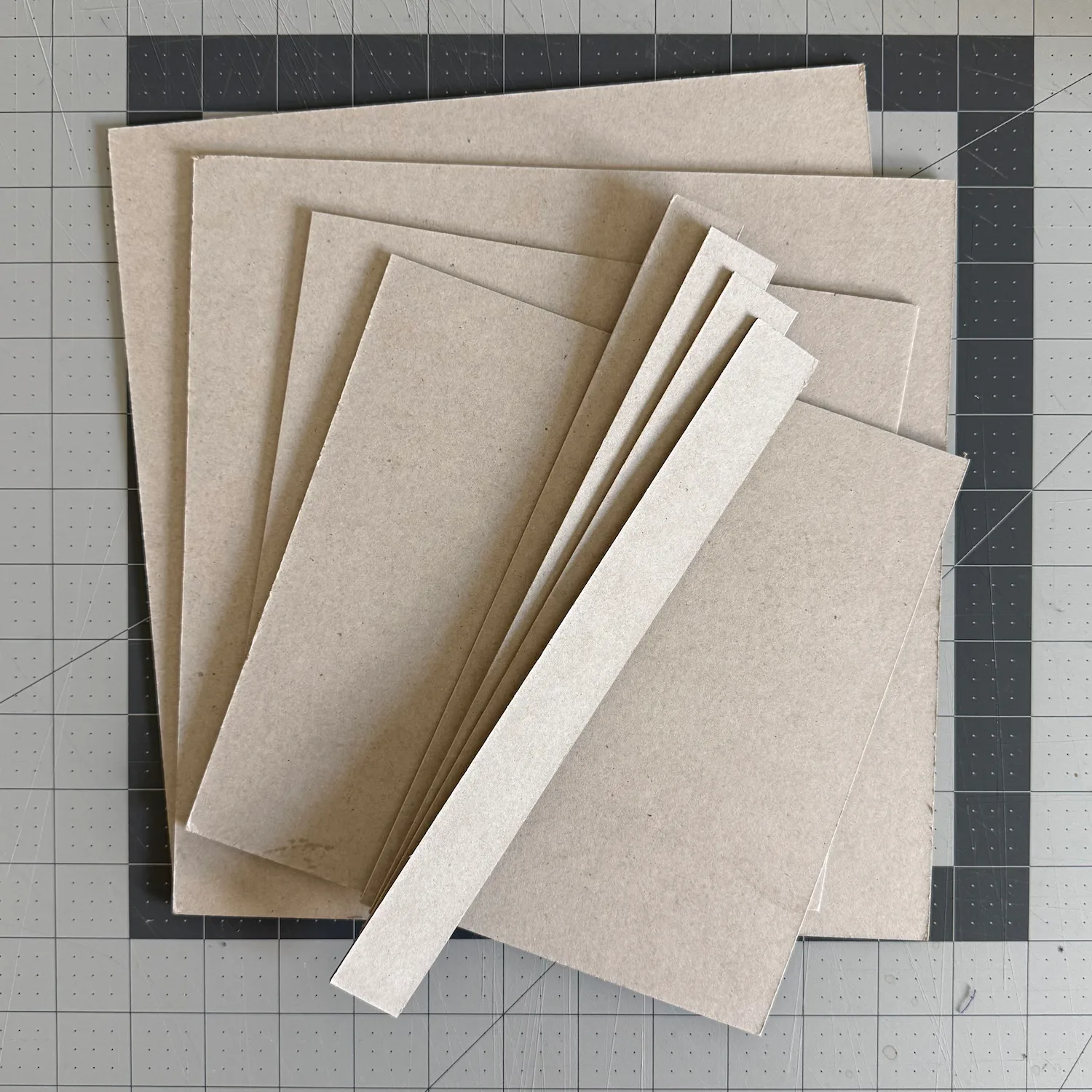 Chipboard pieces cut for the valet tray structure