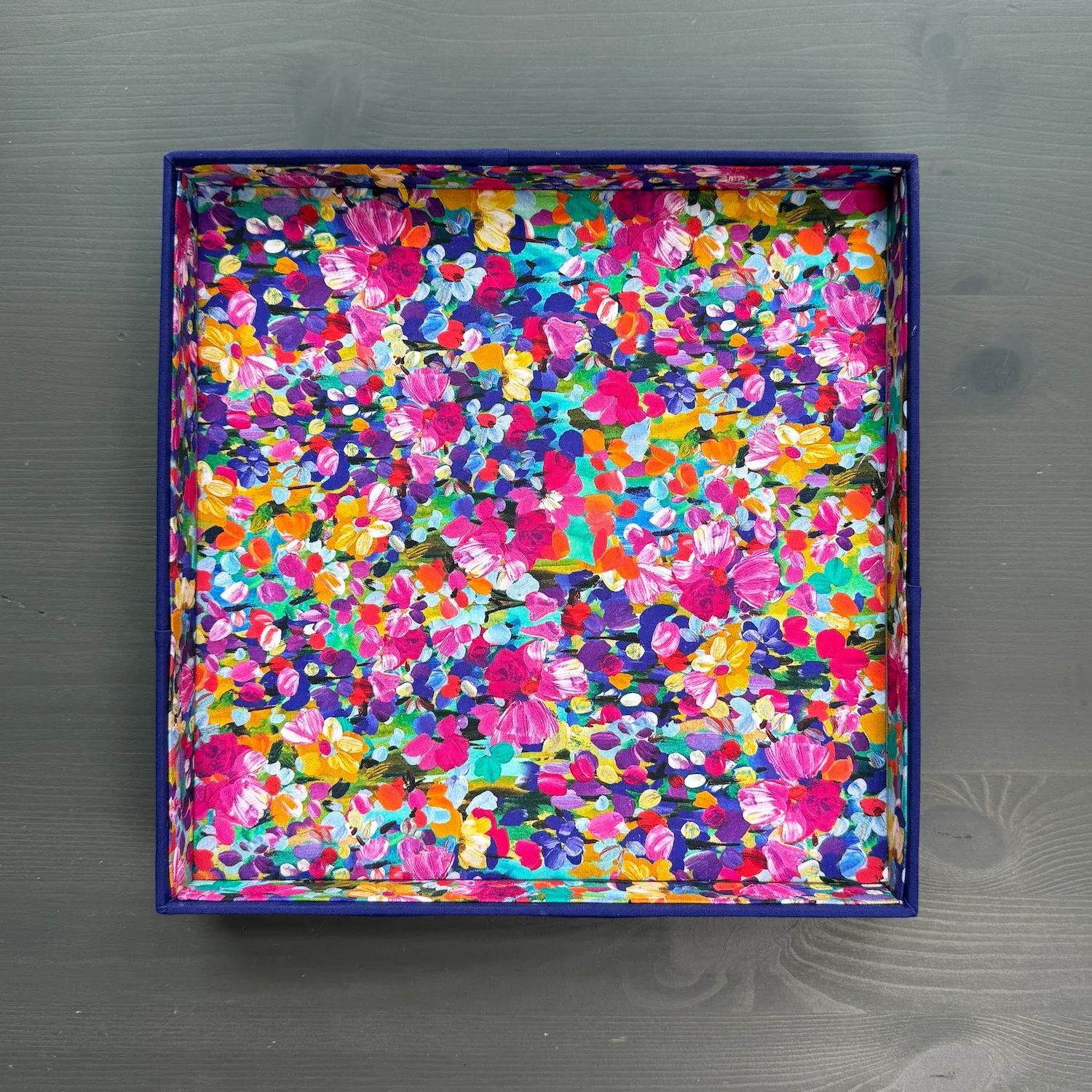 Finished floral fabric-covered valet tray viewed from above