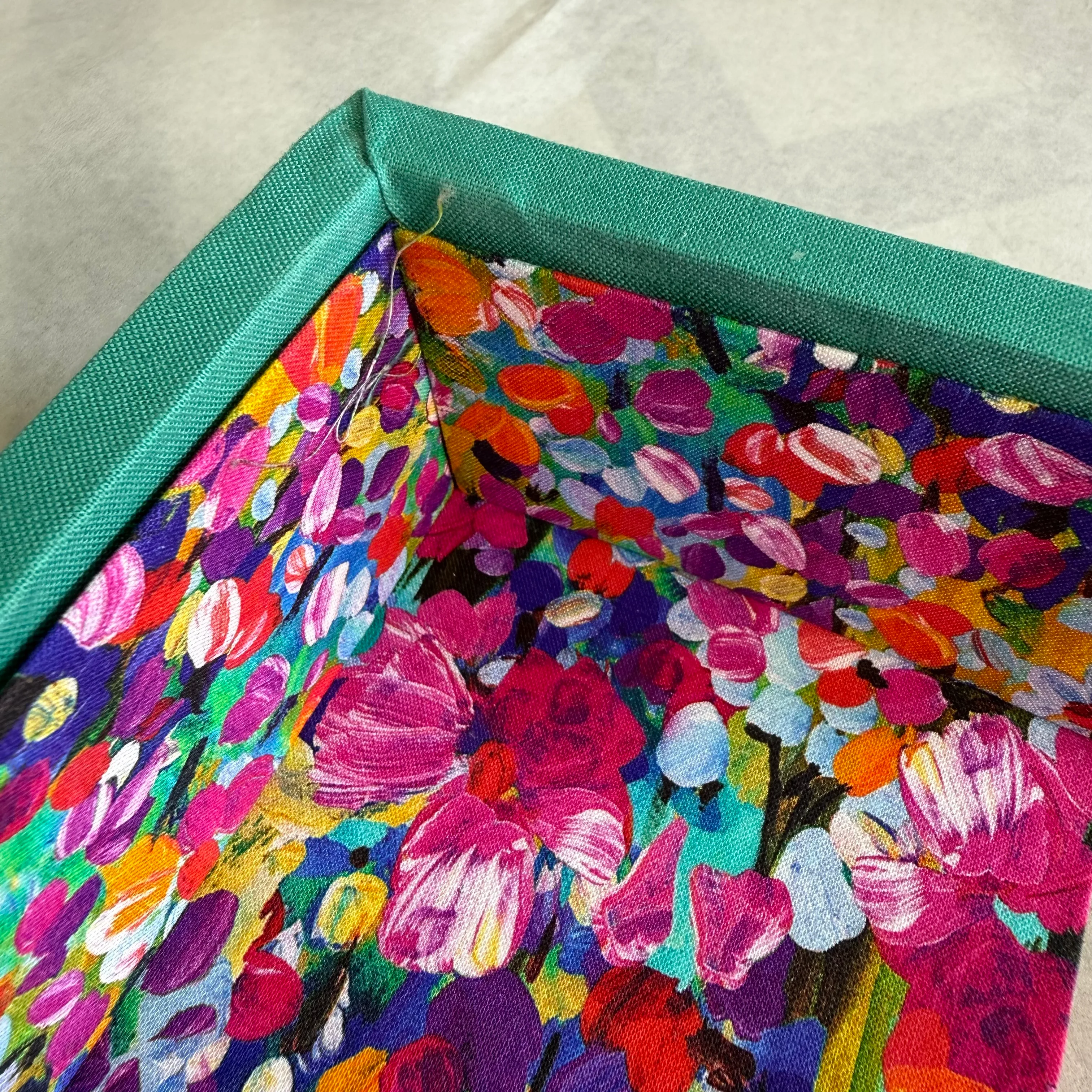 Placing fabric-covered lining panels inside a container