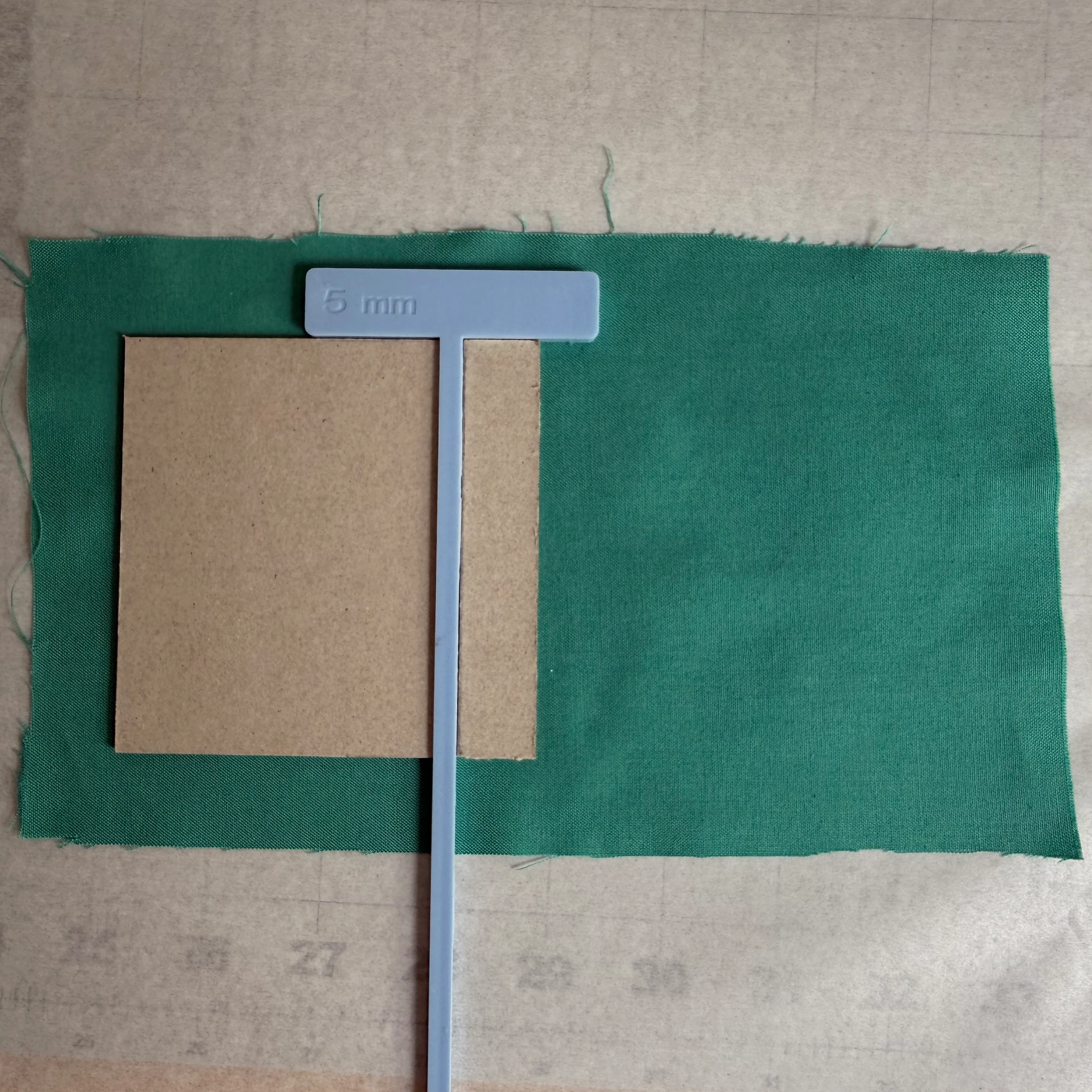 Chipboard pieces aligned with measured hinge gaps