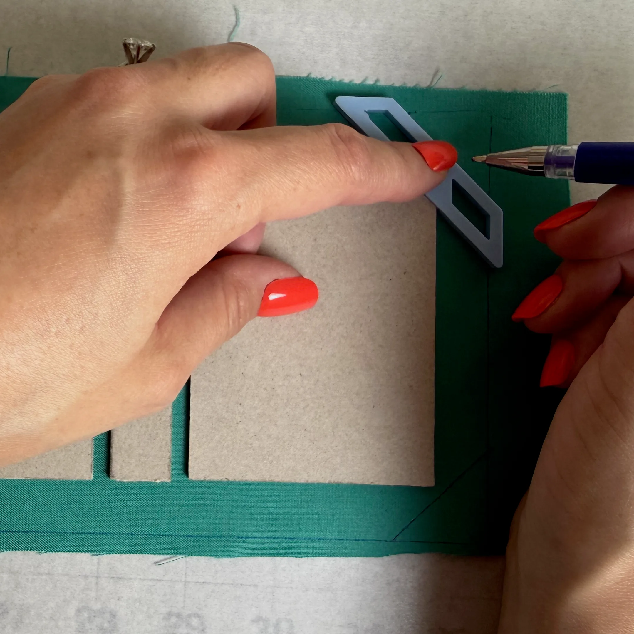 Marking trim lines beside the chipboard pieces