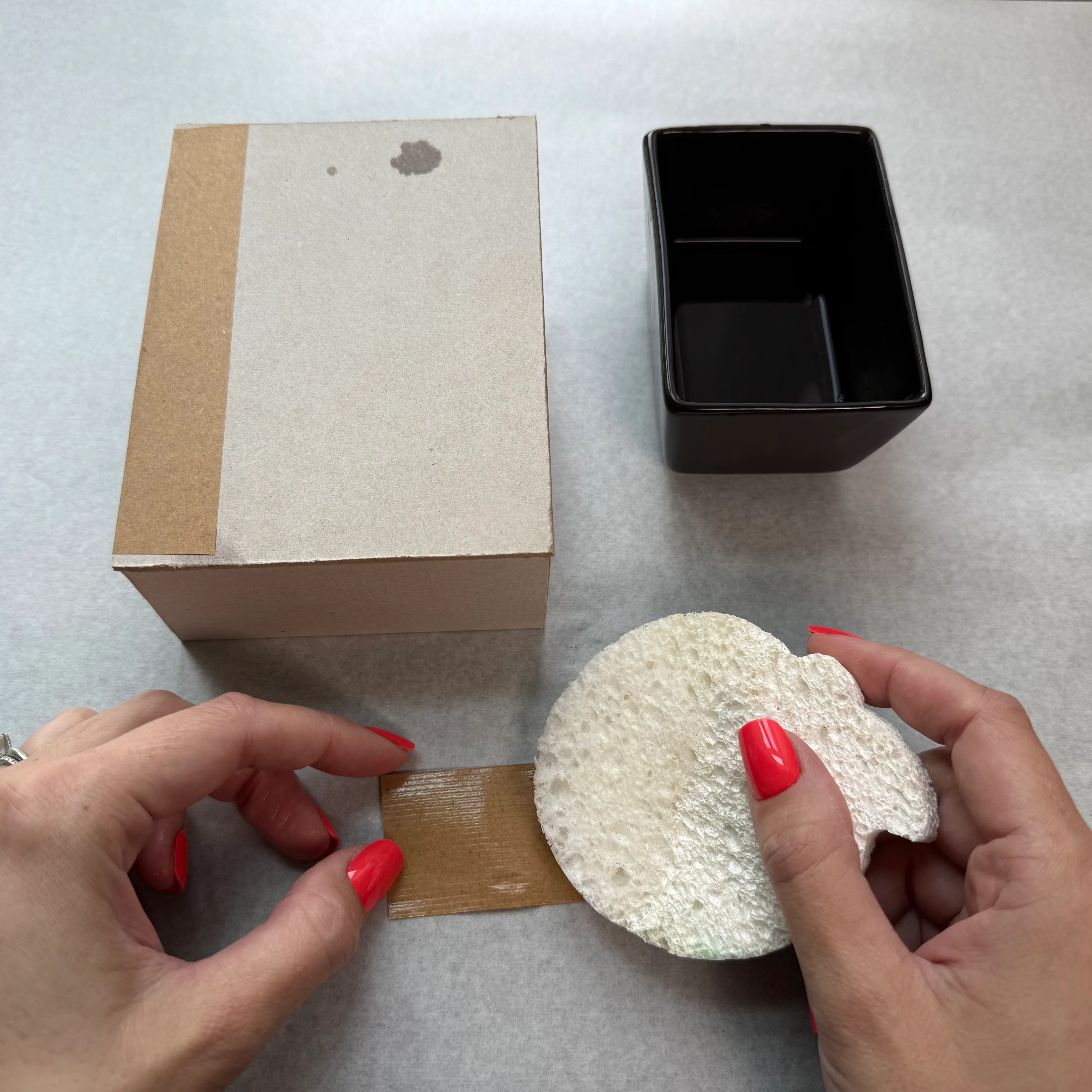 Activating the adhesive on bookbinding tape