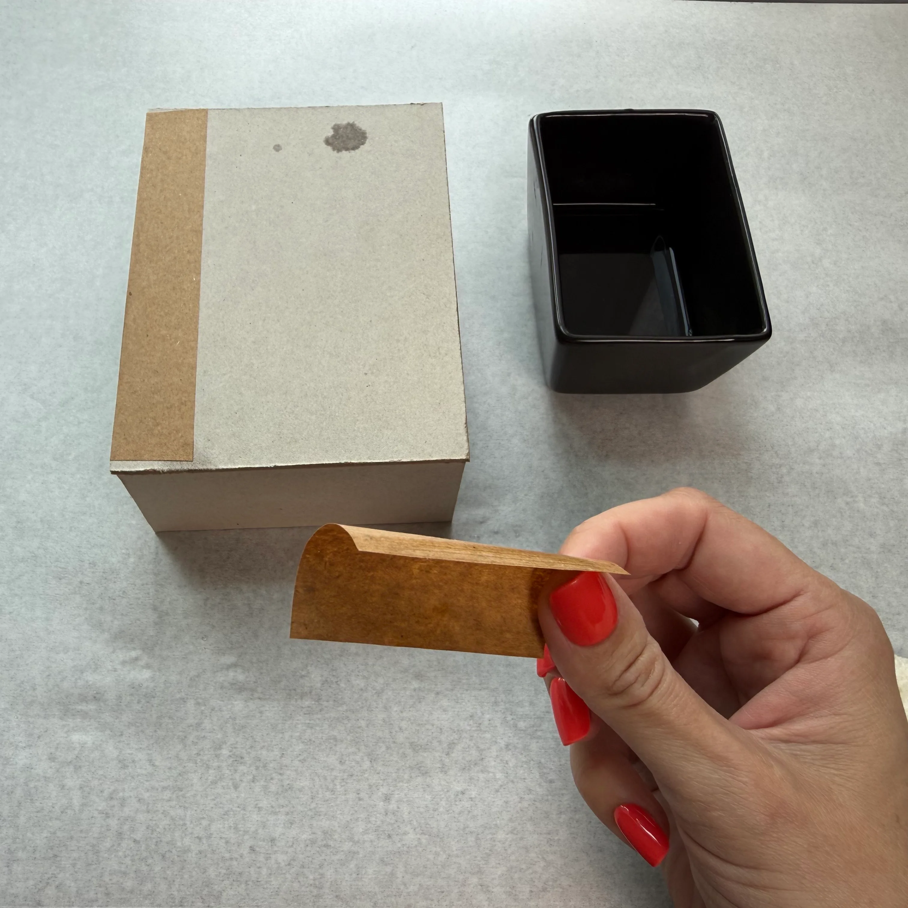 Applying water-activated tape to a chipboard seam