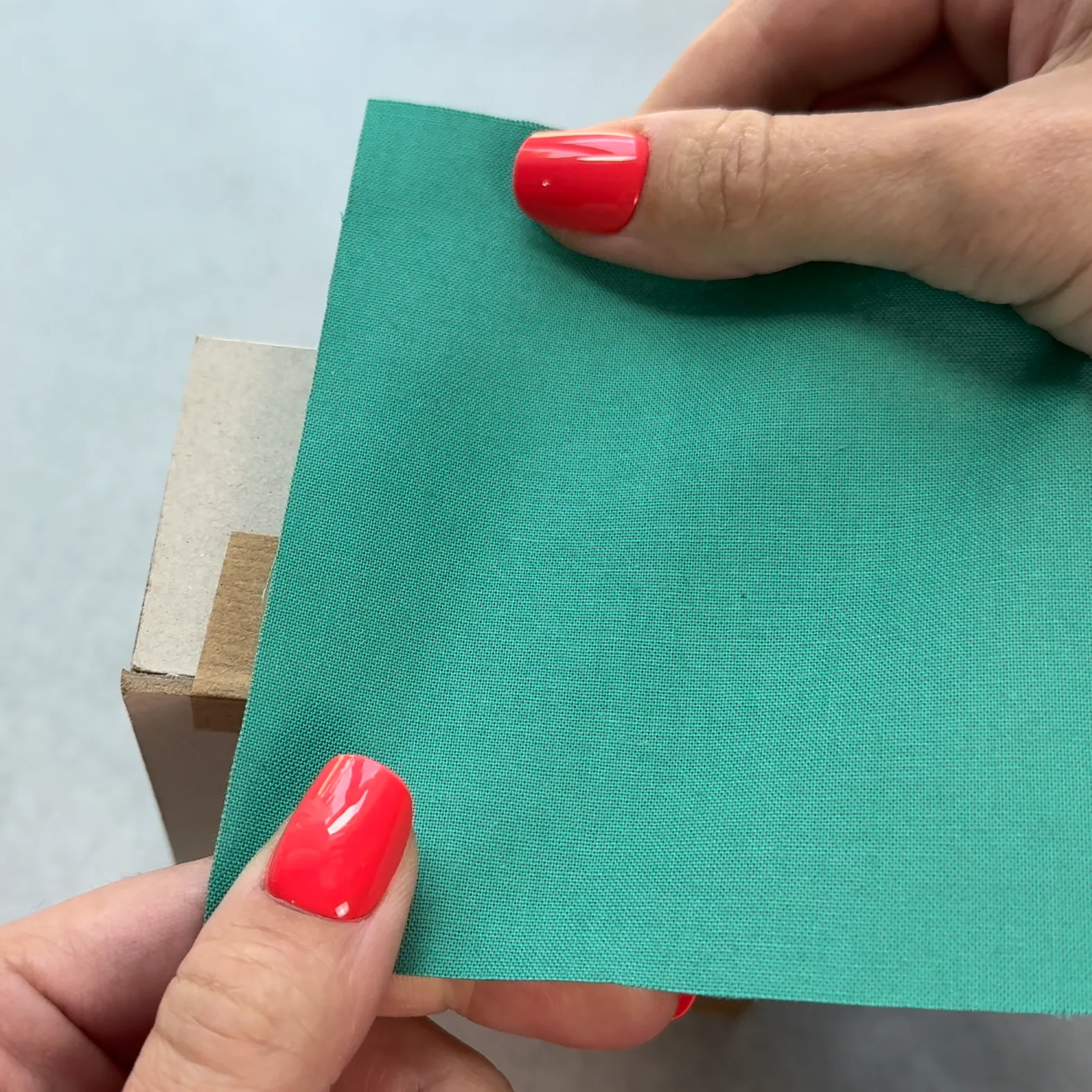 Test-fitting fabric around a chipboard box exterior