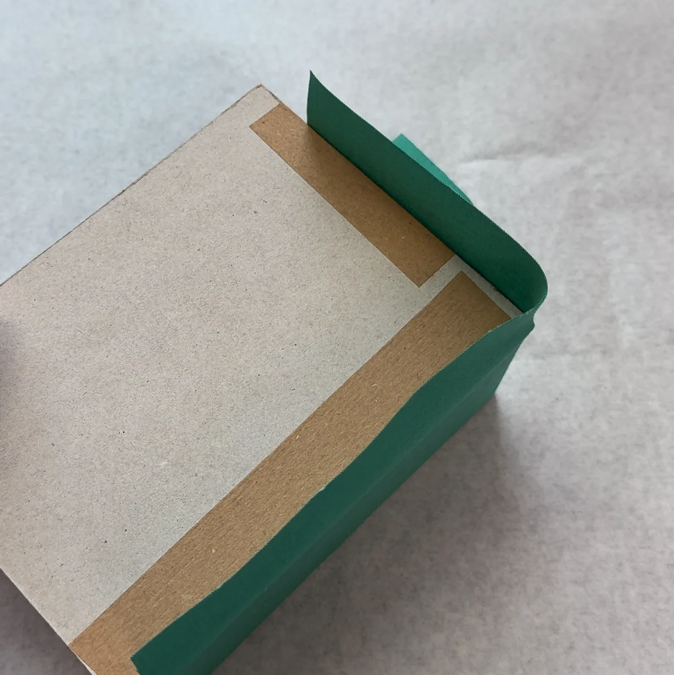 Beginning the bottom corner folds