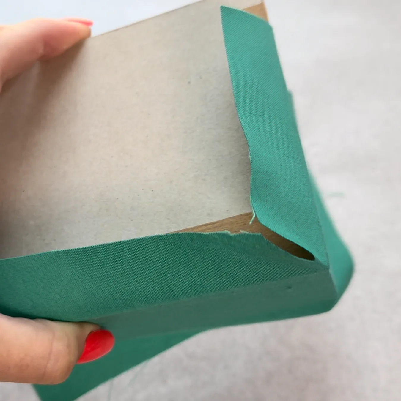 Shaping the second fold at a bottom corner