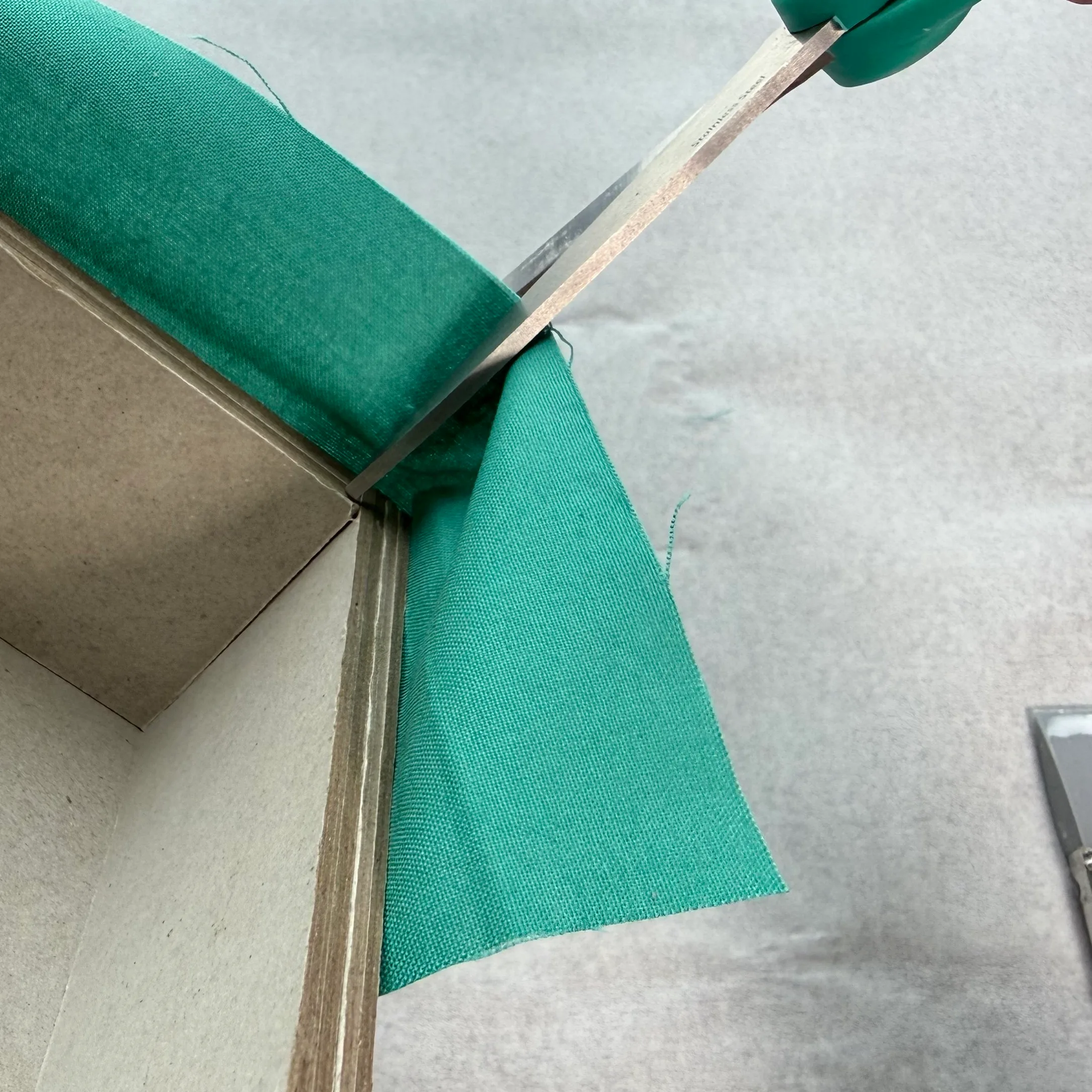 Clipping fabric at a top box corner