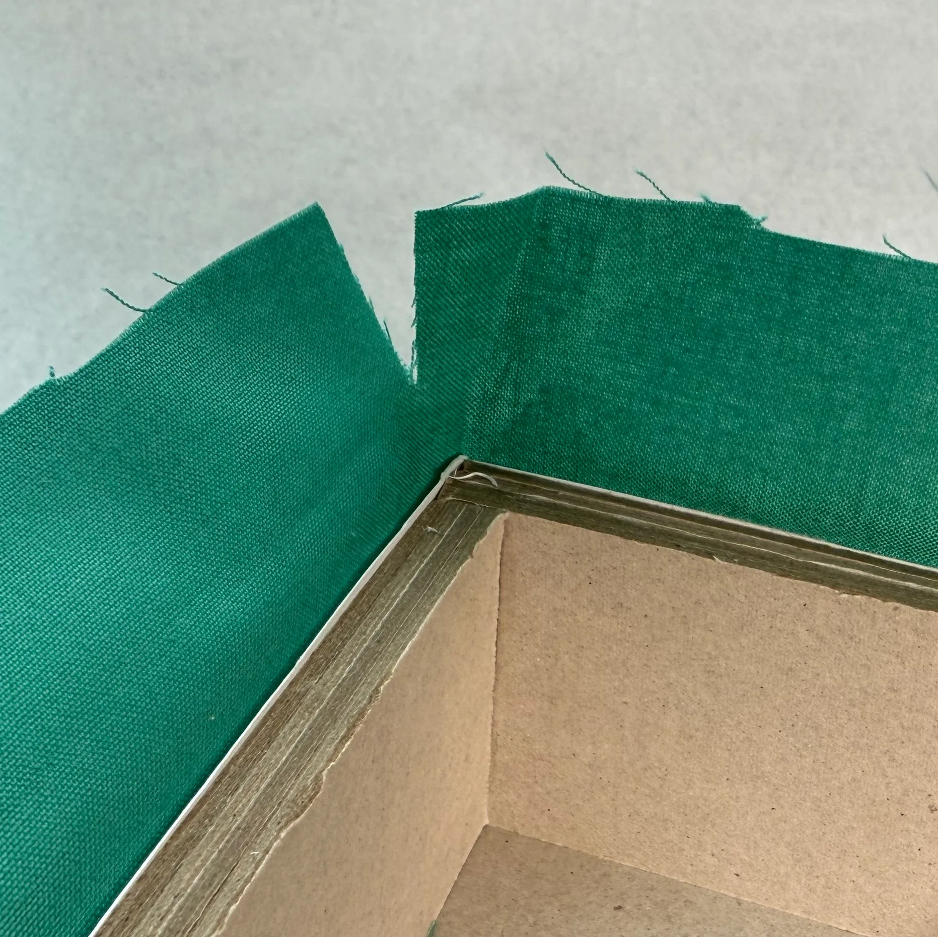 Folding fabric around the top corner