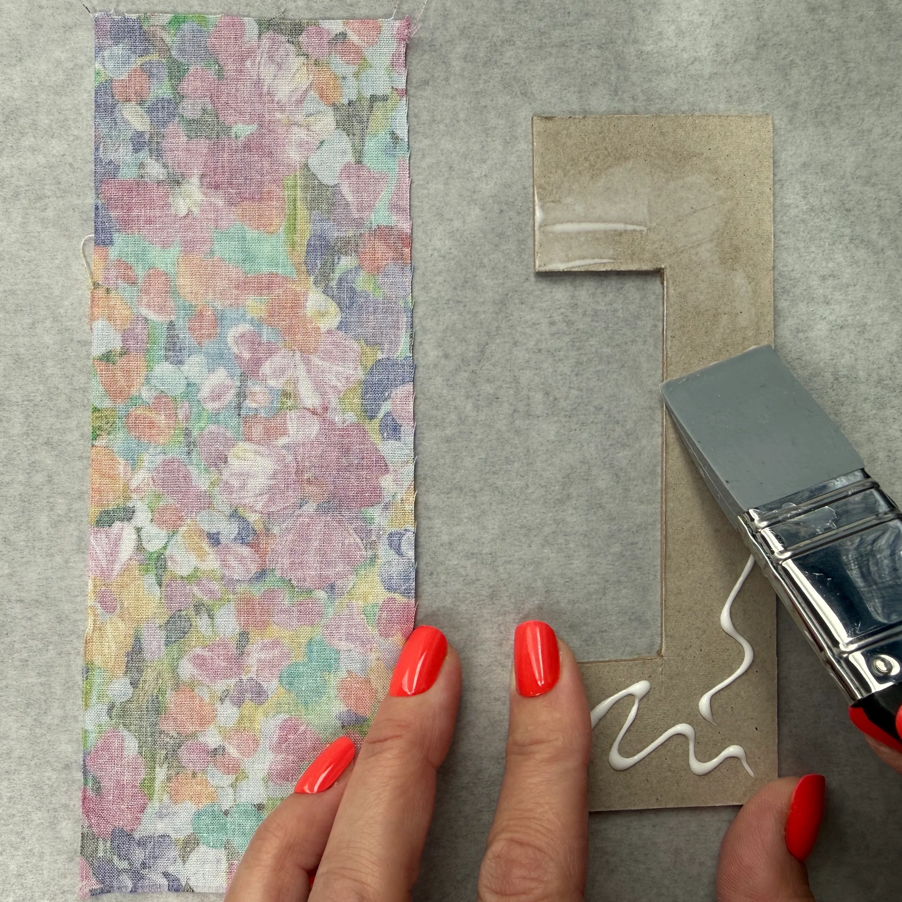 Applying glue to the frame before covering it