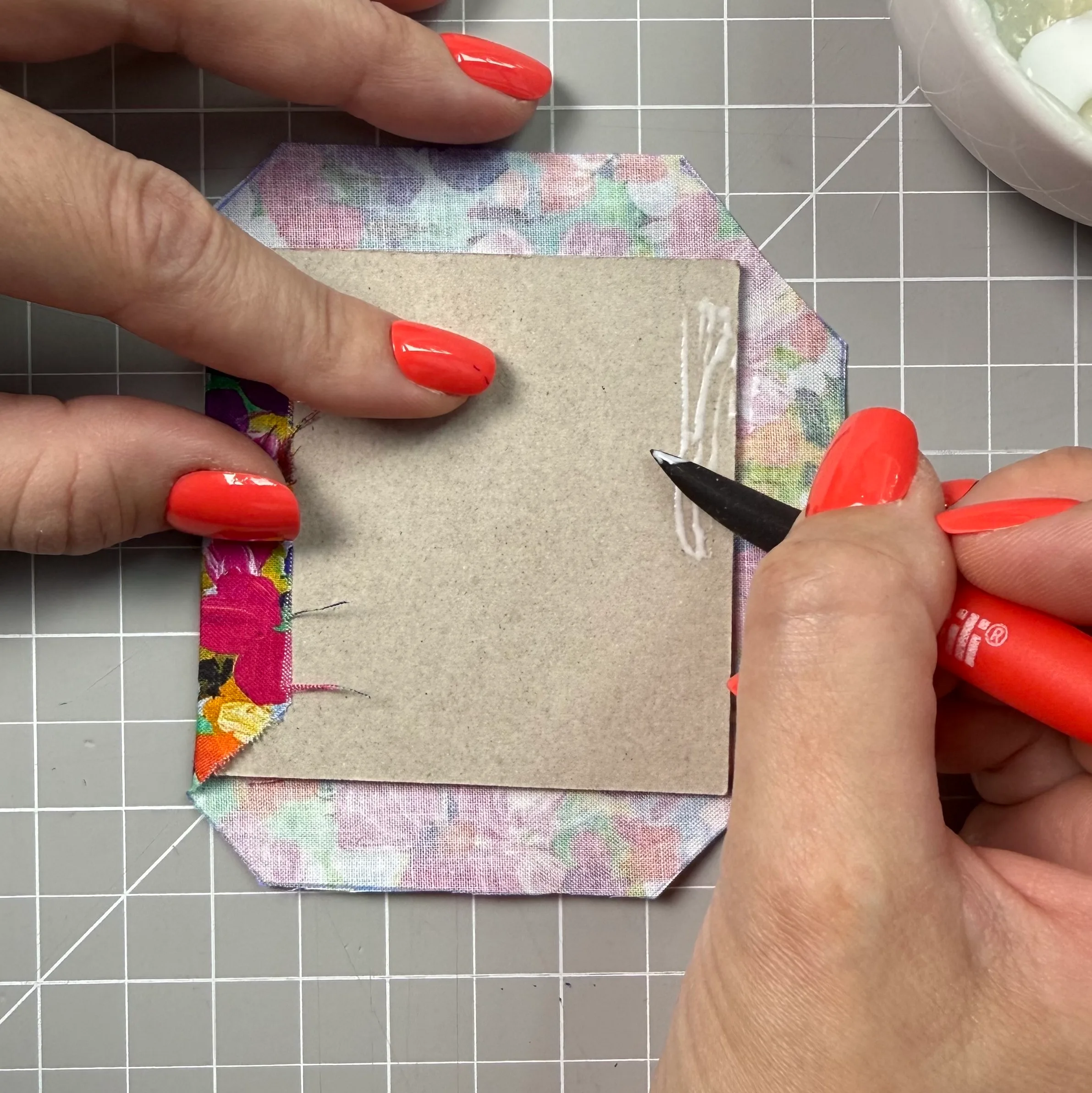 Applying glue to the first fabric edges