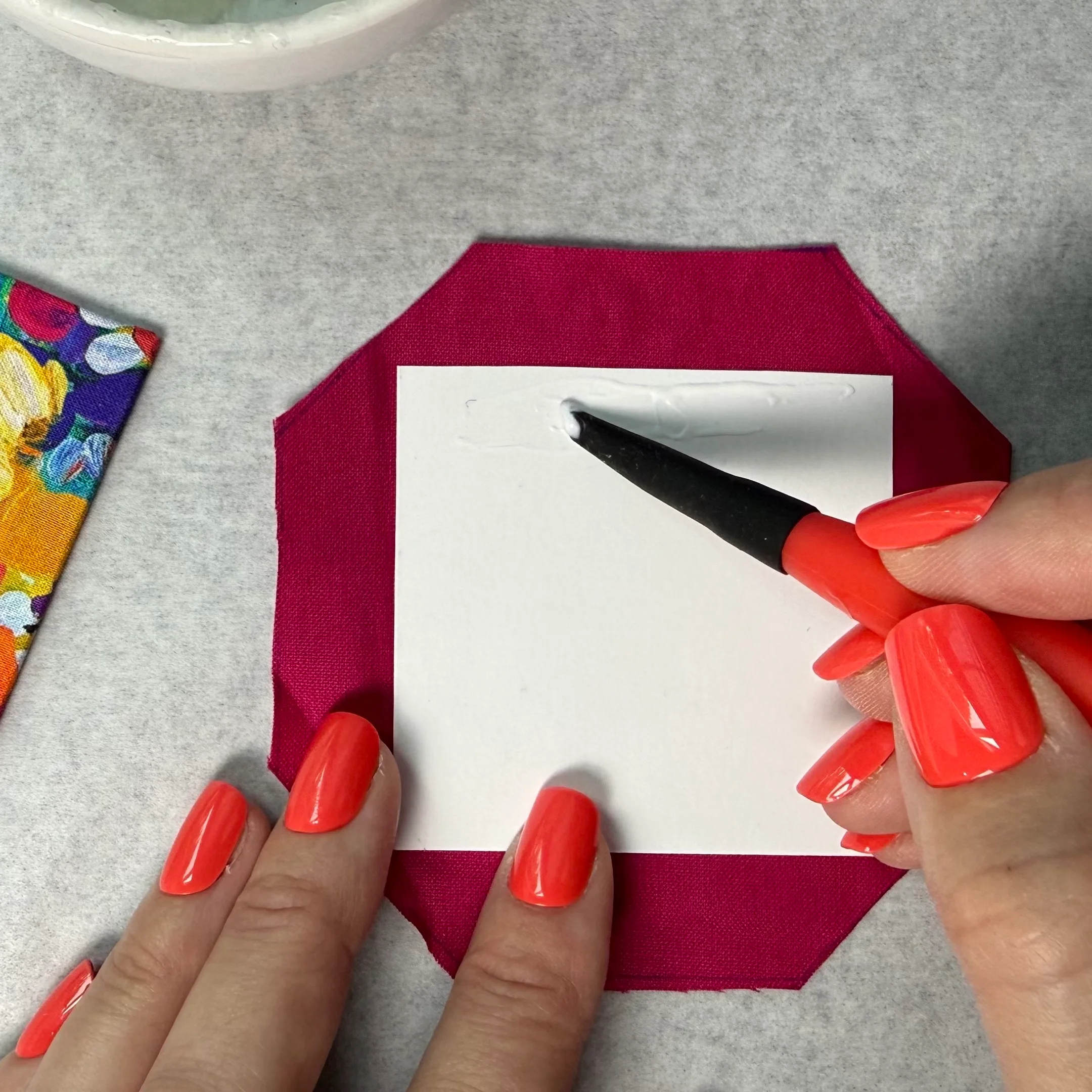 Applying glue to a cardstock panel